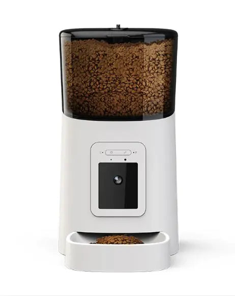 White pet food dispenser with black top containing pet food on a white background